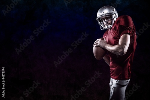 Composite image of american football player holding ball © vectorfusionart