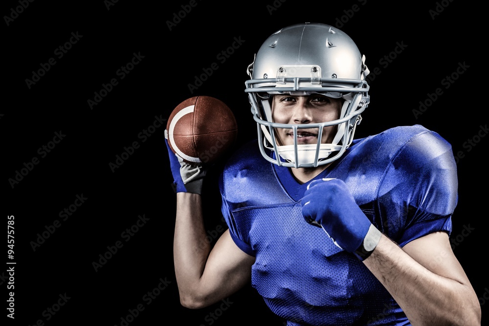 Composite image of sportsman smiling while throwing ball Composite image of sportsman smiling while throwing ball