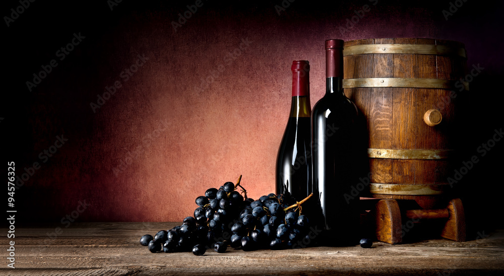 Bottles with cask and grape