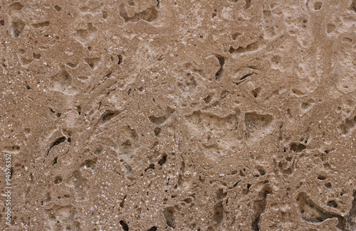Texture of the beige sand stone wall with scratches for grunge b