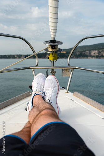 white sailing shoes on deck of a sailing boat © meanmachine77
