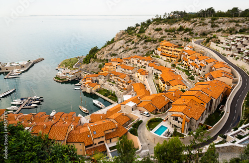 little italian marina with sailing and motor boats