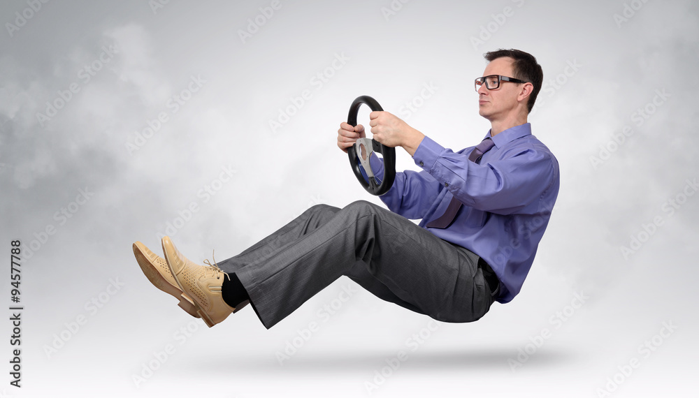 Businessman driver in glasses and tie with a wheel, car drive concept Businessman driver in glasses and tie with a wheel, car drive concept