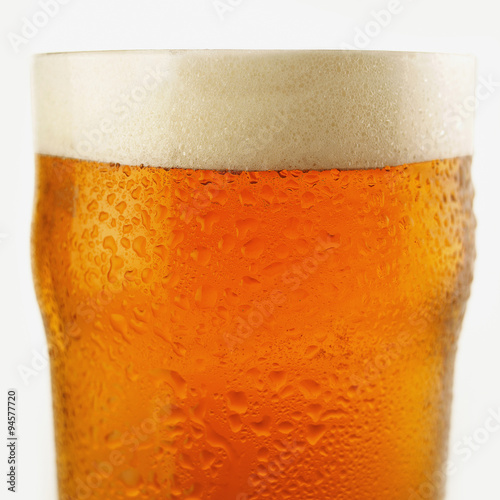 Close up of a freshly poured pint of chilled lager beer Fototapeta