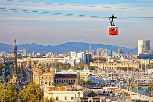 Red cabin of cableway stands out on Barcelona's port