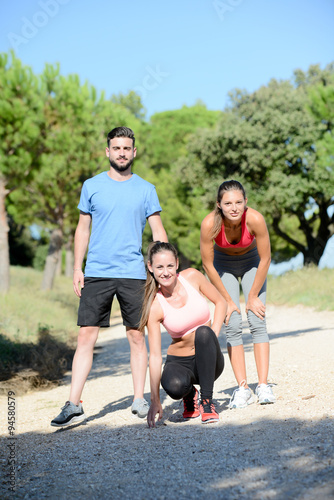group of young healthy fitness people running outdoor in summer