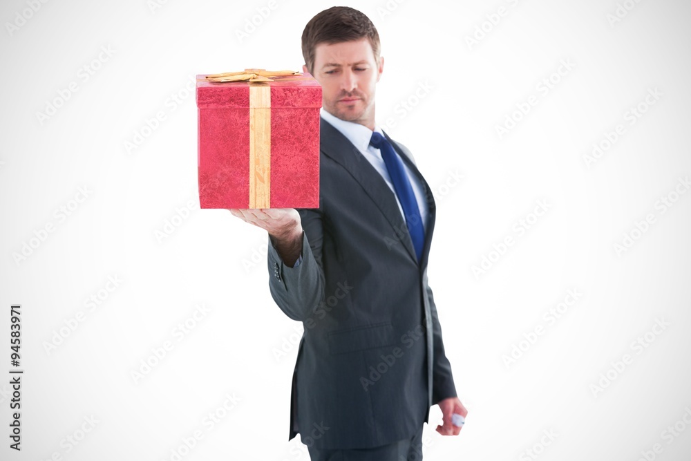 Composite image of businessman holding hand out in presentation Composite image of businessman holding hand out in presentation