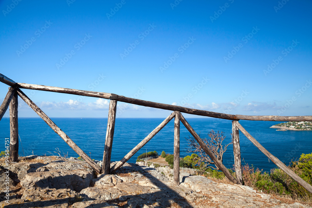 Wooden railing on coast of Mediterranean sea
