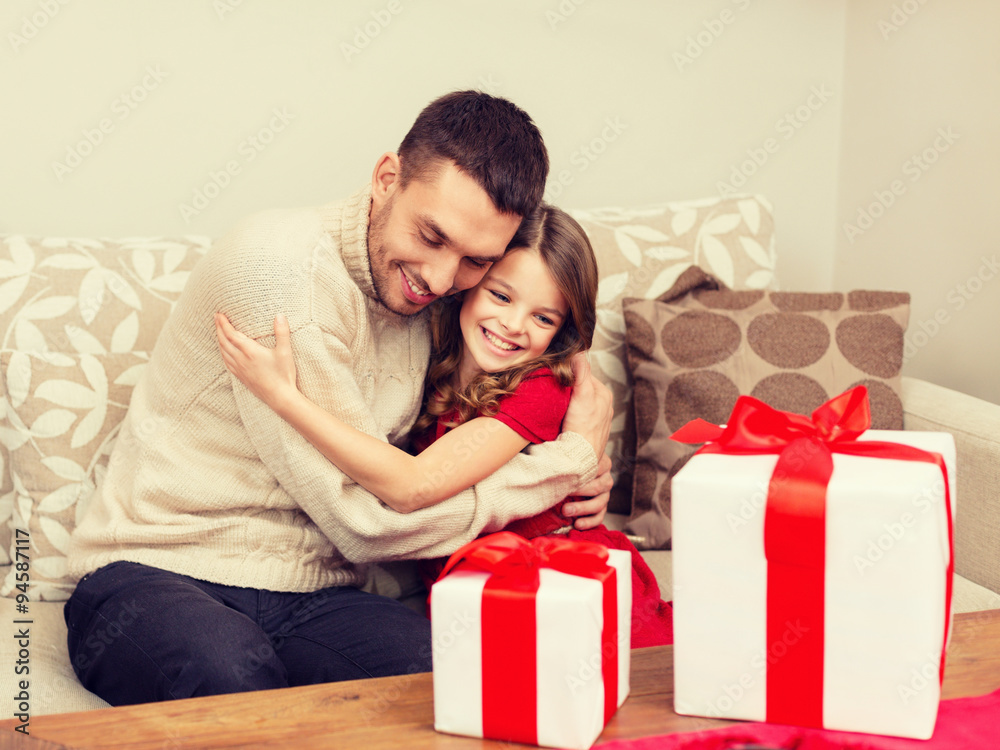 smiling father and daughter hugging smiling father and daughter hugging