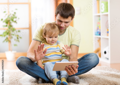 daddy and son kid playing w...