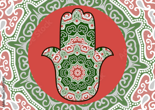 Card with a pattern in ethnic style - red and green hamsa with mandala on background