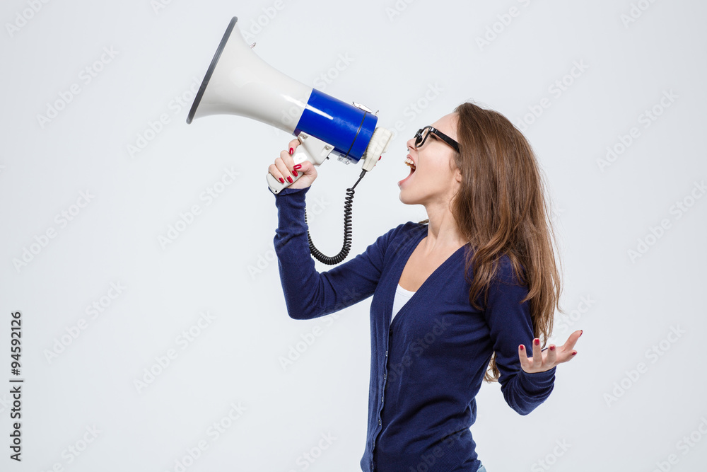 Beautiful woman shouting in loudspeaker Beautiful woman shouting in loudspeaker
