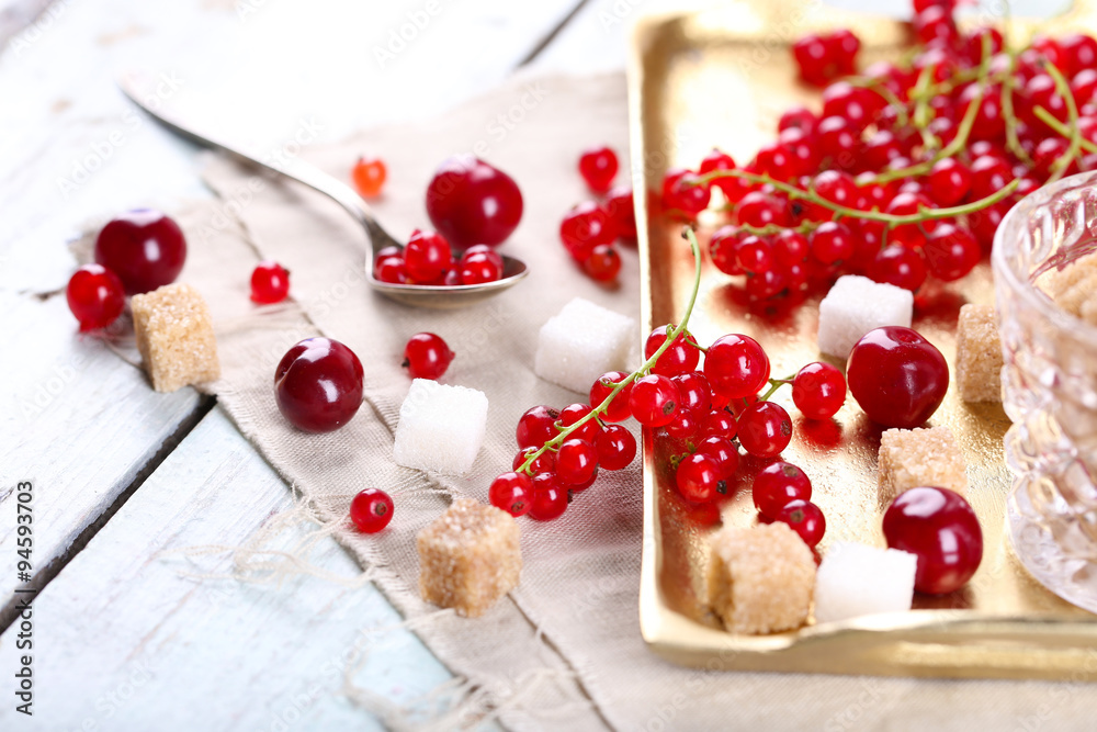 Fresh red currants with sugar on table close up Fresh red currants with sugar on table close up