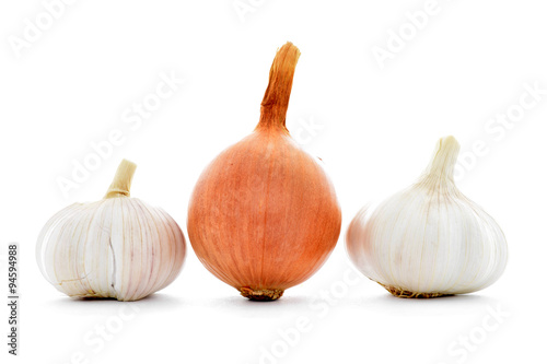 Whole fresh gold onion, two garlic bulbs isolated on white