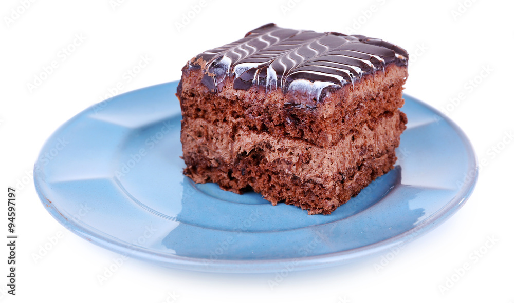 Sweet chocolate cake on blue plate isolated on white background Sweet chocolate cake on blue plate isolated on white background