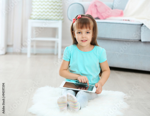Little cute girl with digit...