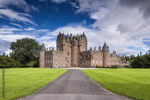 View of Glamis Castle in Scotland, United Kingdom. Glamis Castle is situated beside the village of Glamis in Angus. It is the home of the Countess of Strathmore and Kinghorne, and is open to public. photo