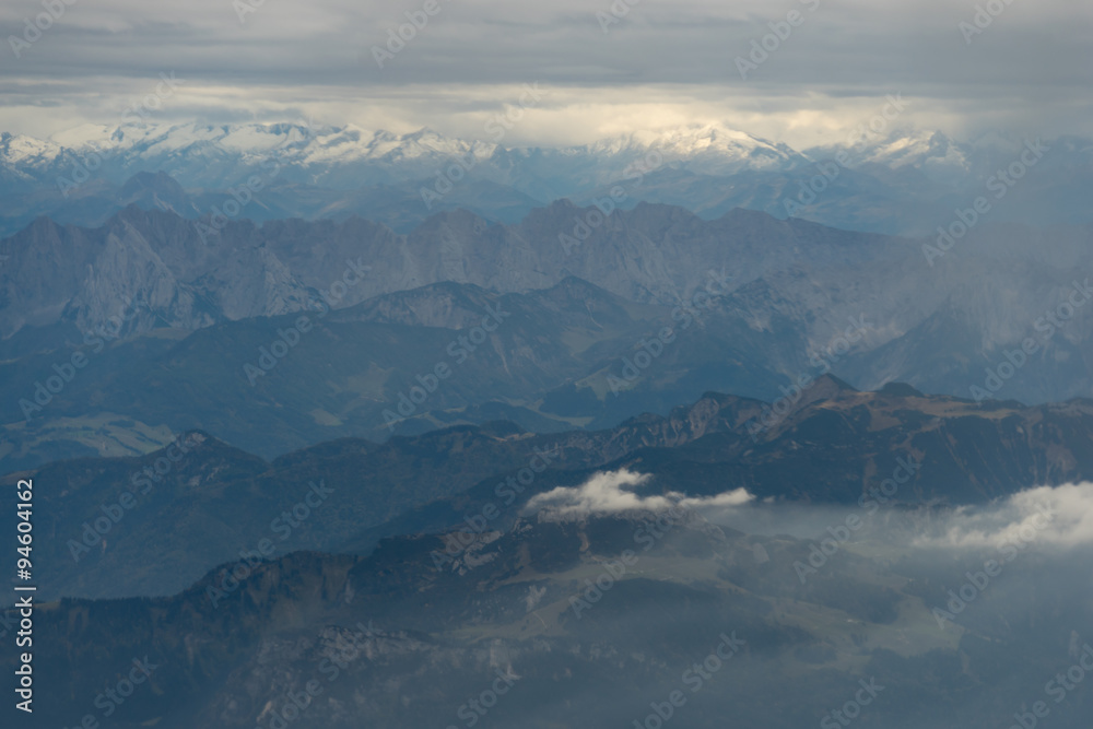 Cloudy Austrian Alps from an Airplane
