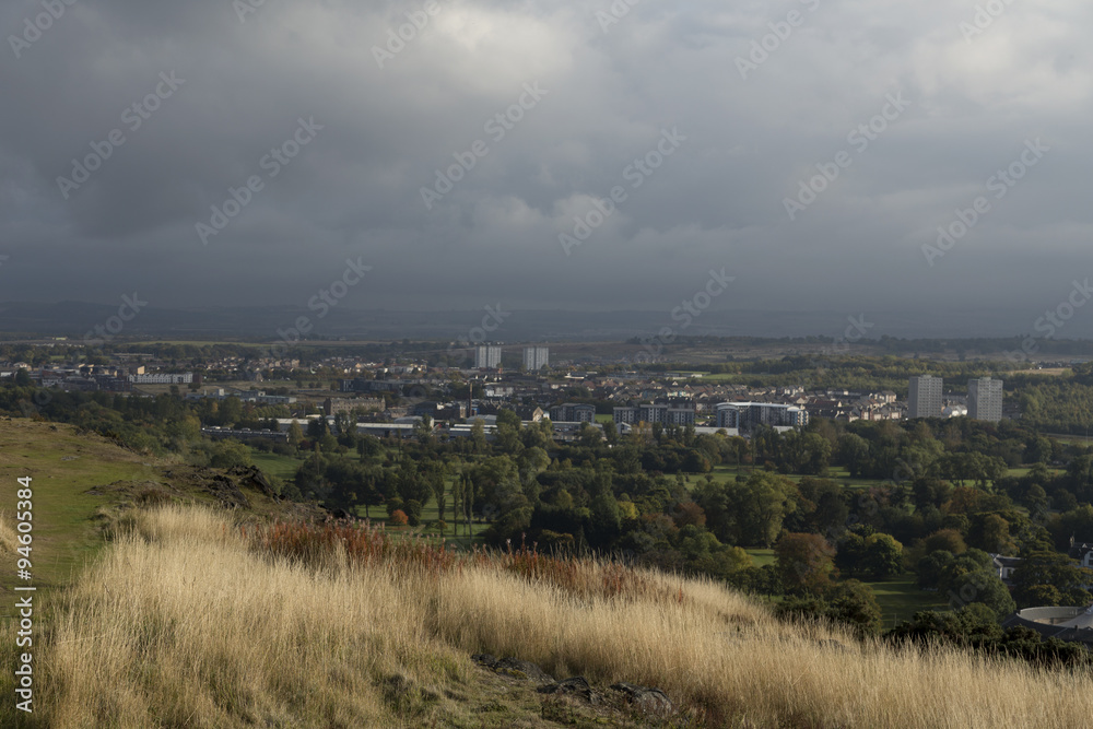 A view over Edinburgh, Scotland from a hill with the city in the background