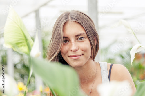 portrait of young beautiful woman on green background
