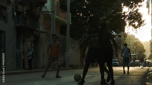 Boys kicking soccer on the old Havana street