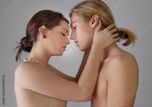 Attractive Topless Couple About to Kiss photo