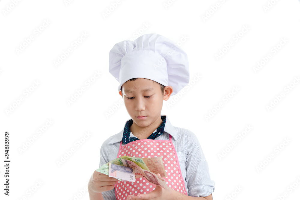 Young Asian cook holding Thai Baht in his hand. Young Asian cook holding Thai Baht in his hand.