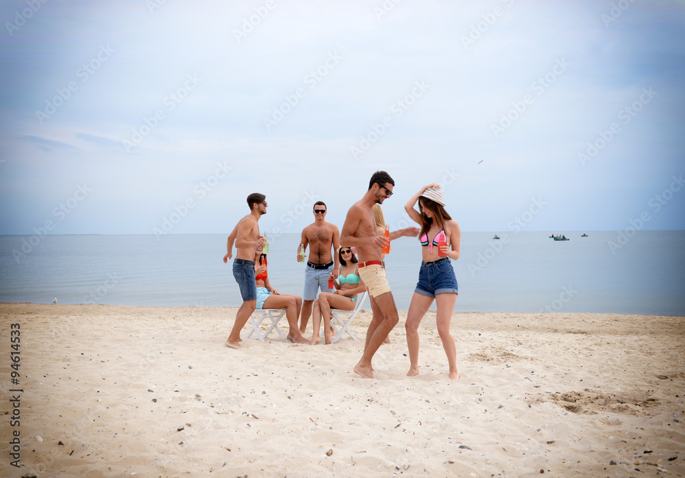 Beautiful young people having fun on beach