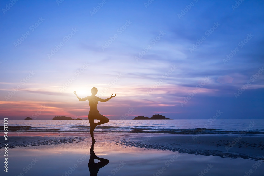 yoga, silhouette of woman on the beach
