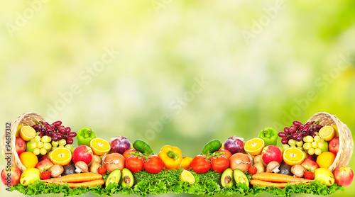 Fototapeta Naklejka Na Ścianę i Meble -  Fruits and vegetables over green background.