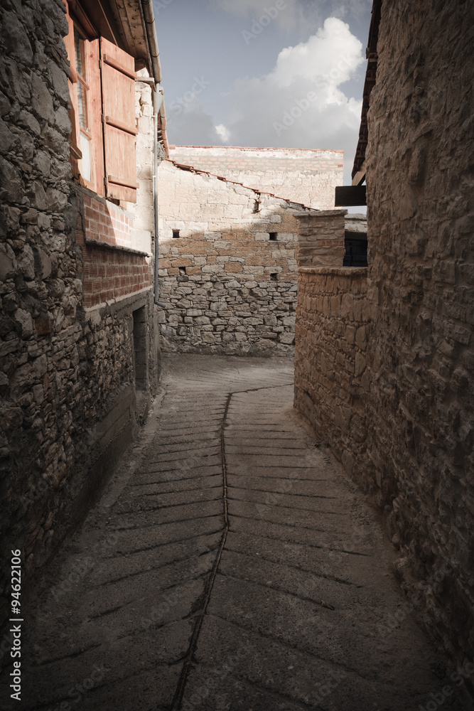 A typical narrow street in the old village of Omodos Cyprus. Vintage style