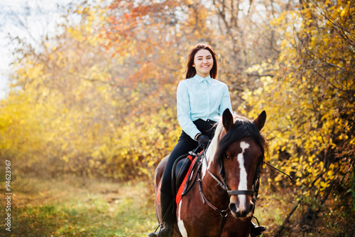Happy woman on horseback 