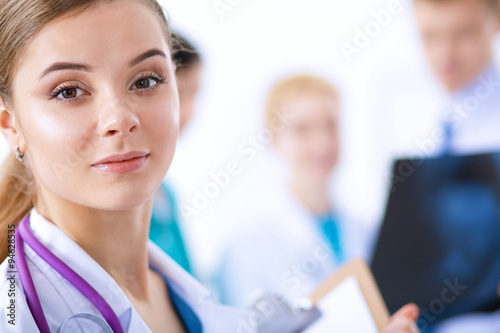 Woman doctor standing with stethoscope at hospital