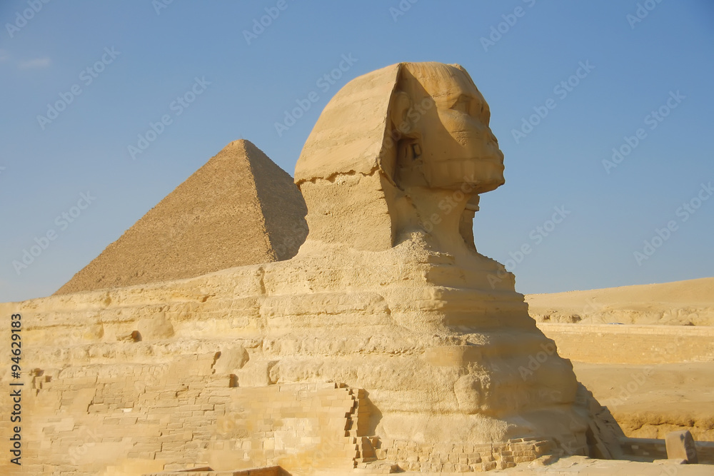 Silhouette of the Sphinx on the background of the pyramid