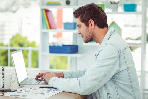 Creative businessman working on his laptop