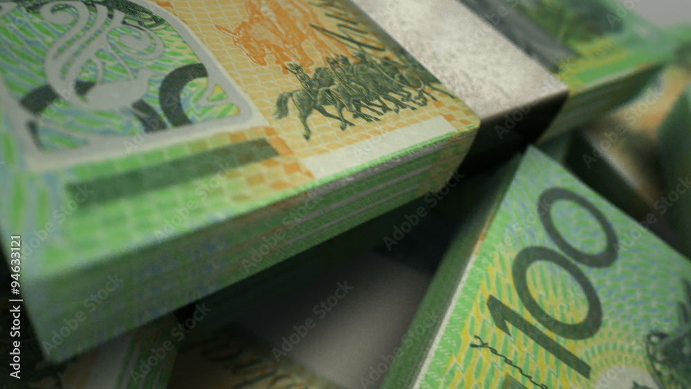 An extreme closeup pan across variously placed bundled wads of Australian dollar banknotes
