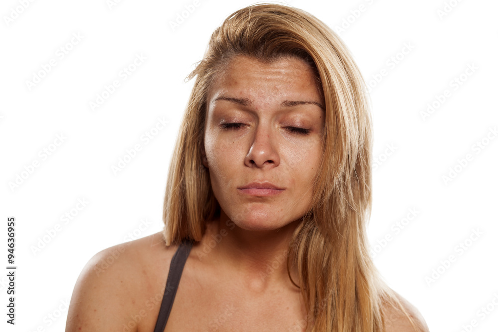 young woman without make-up with closed eyes young woman without make-up with closed eyes