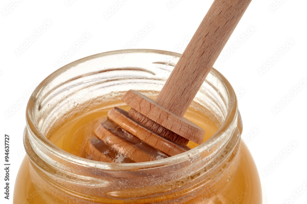 Cuillère à miel dans un pot de miel Cuillère à miel dans un pot de miel