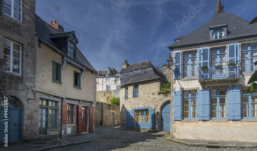 Medieval cobbled street and buildings in the city of Dinan, Brittany, France