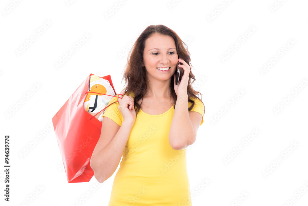 Junge brünette Frau mit smartphone beim Shoppen Junge brünette Frau mit smartphone beim Shoppen