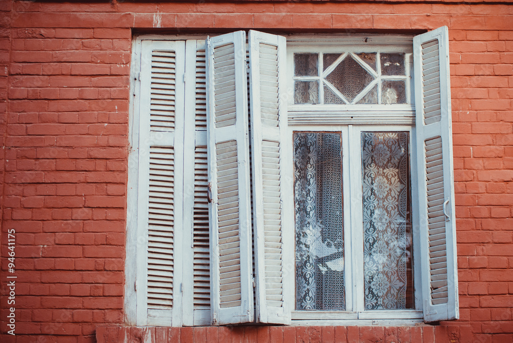 Fototapeta premium Old traditional wooden window captured in Korca, a small town situated in south east of Albania.