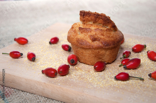 Corn bread - organic homemade,decorated with red wild dog roses and corn flour