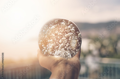 sfera di cristallo tra i raggi del sole  photo