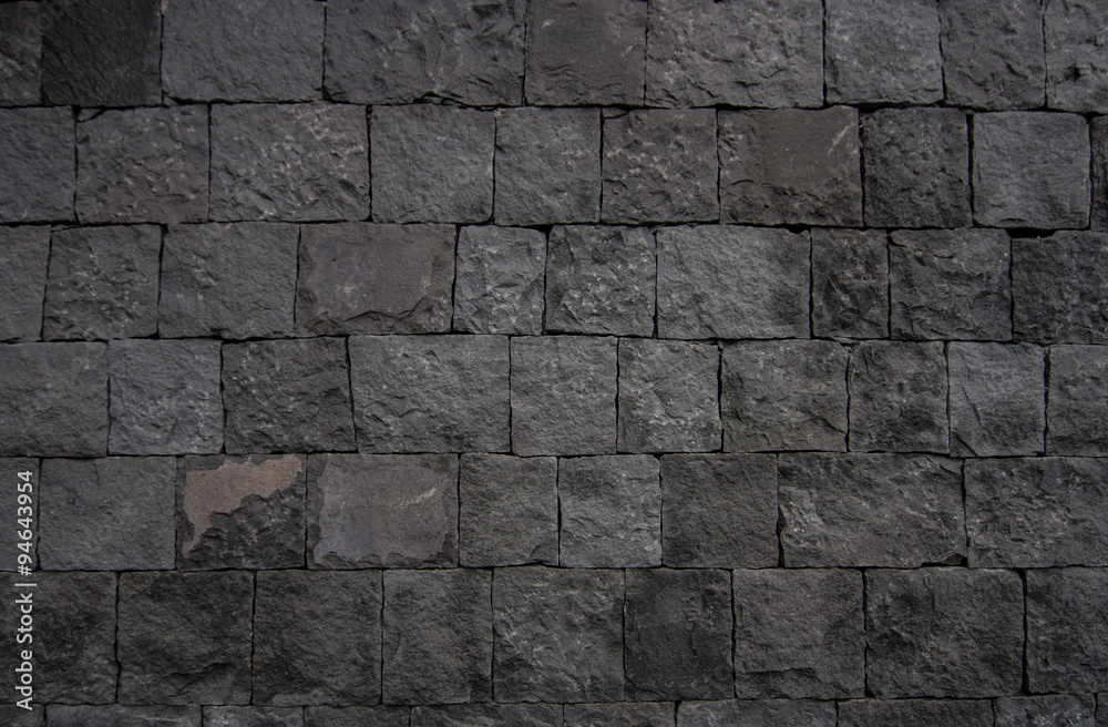 wall background of volcanic basalt stone texture - architecture background