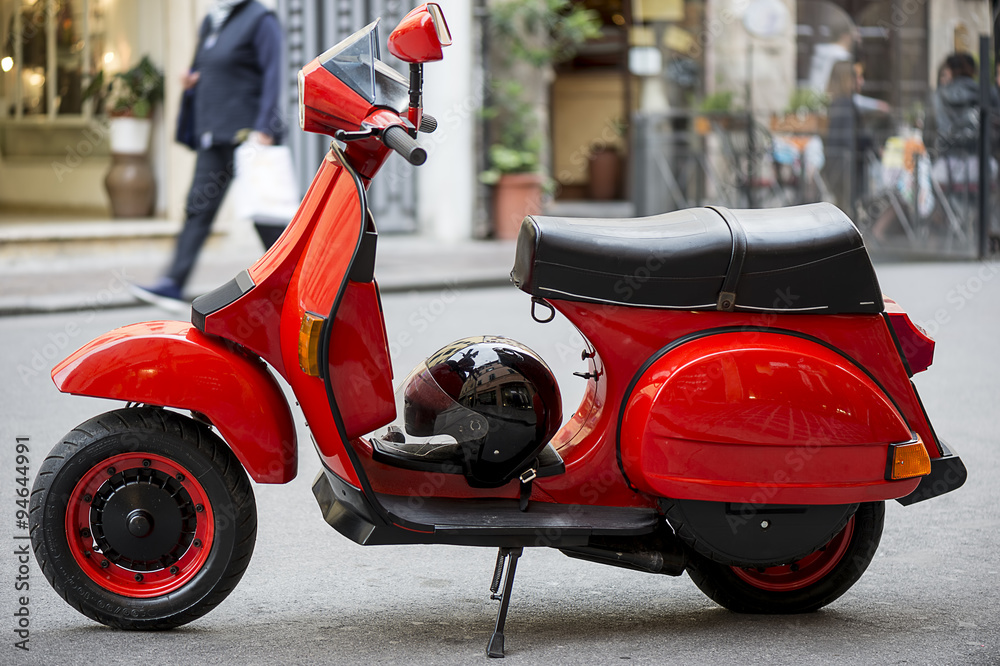 Typical Italian scooter parked in the city center
