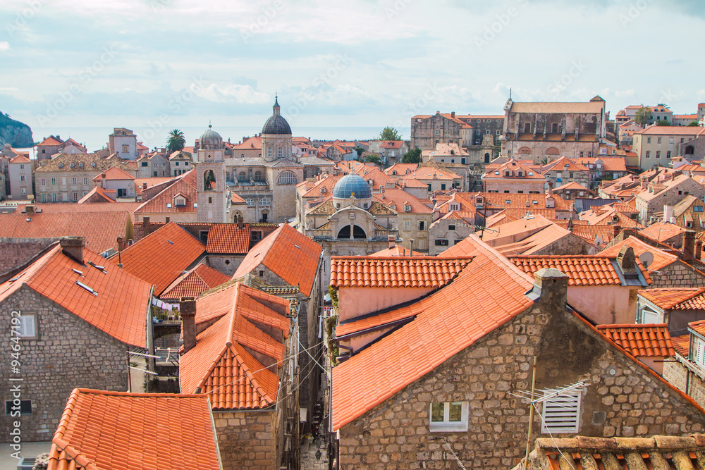 Tower bell and roofs of old houses in old town Dubrovnik, Croatia 