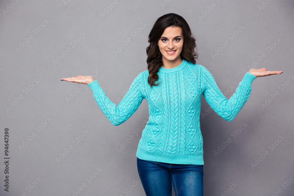 Happy woman holding copyspace on the palms Happy woman holding copyspace on the palms