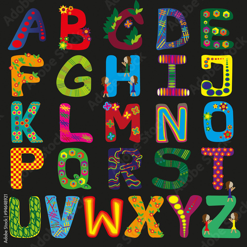many colorful letters on black background