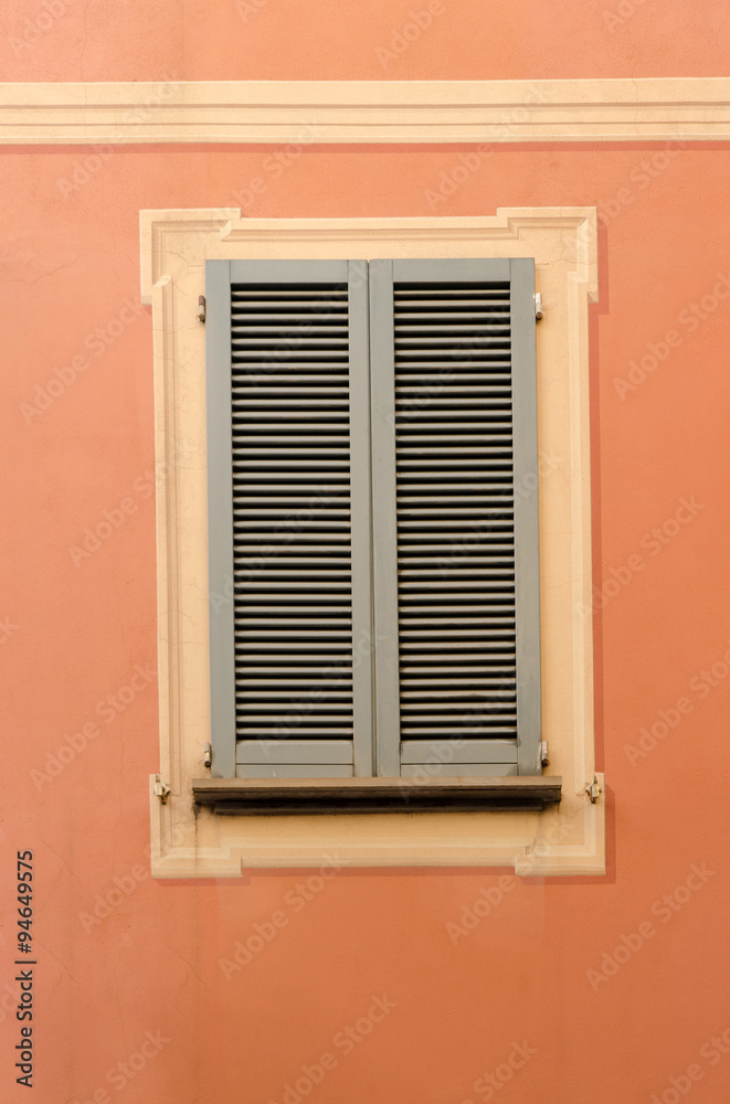 retro decorative wooden shutters on the exterior of the urban building