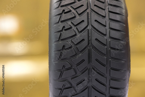 Close-up about black rubber tyre for car model © RiumaLab